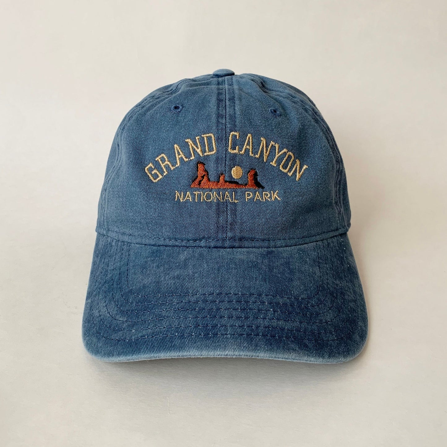 Washed blue dad hat embroidered with Grand Canyon National Park scene and text – ideal for hikers and park lovers