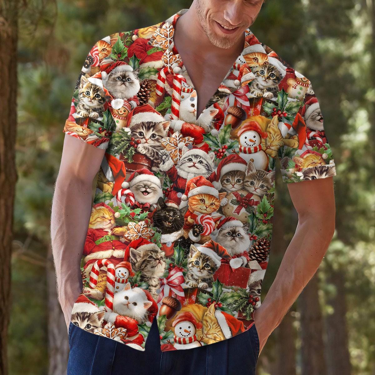 Person modeling a festive kitten and snowman Hawaiian shirt outdoors