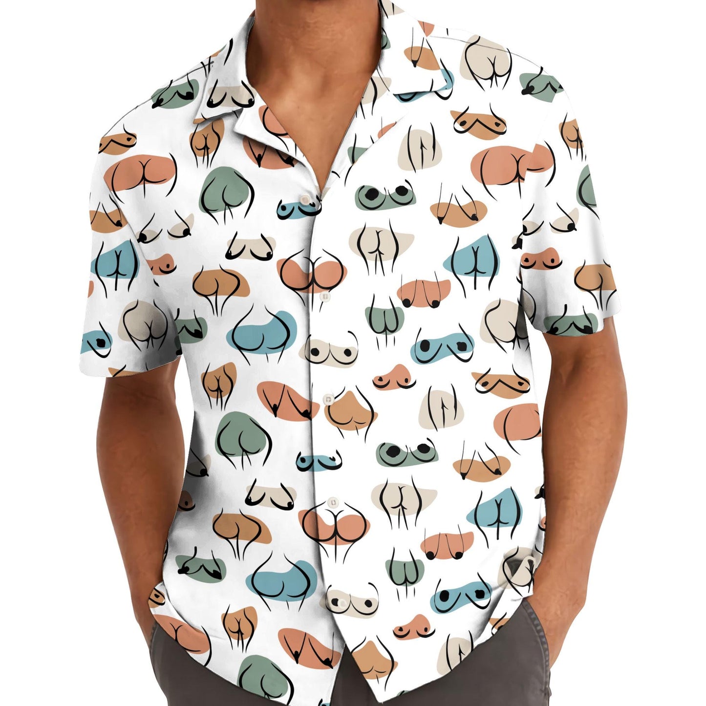Model wearing a whimsical colorful face print Hawaiian shirt outdoors