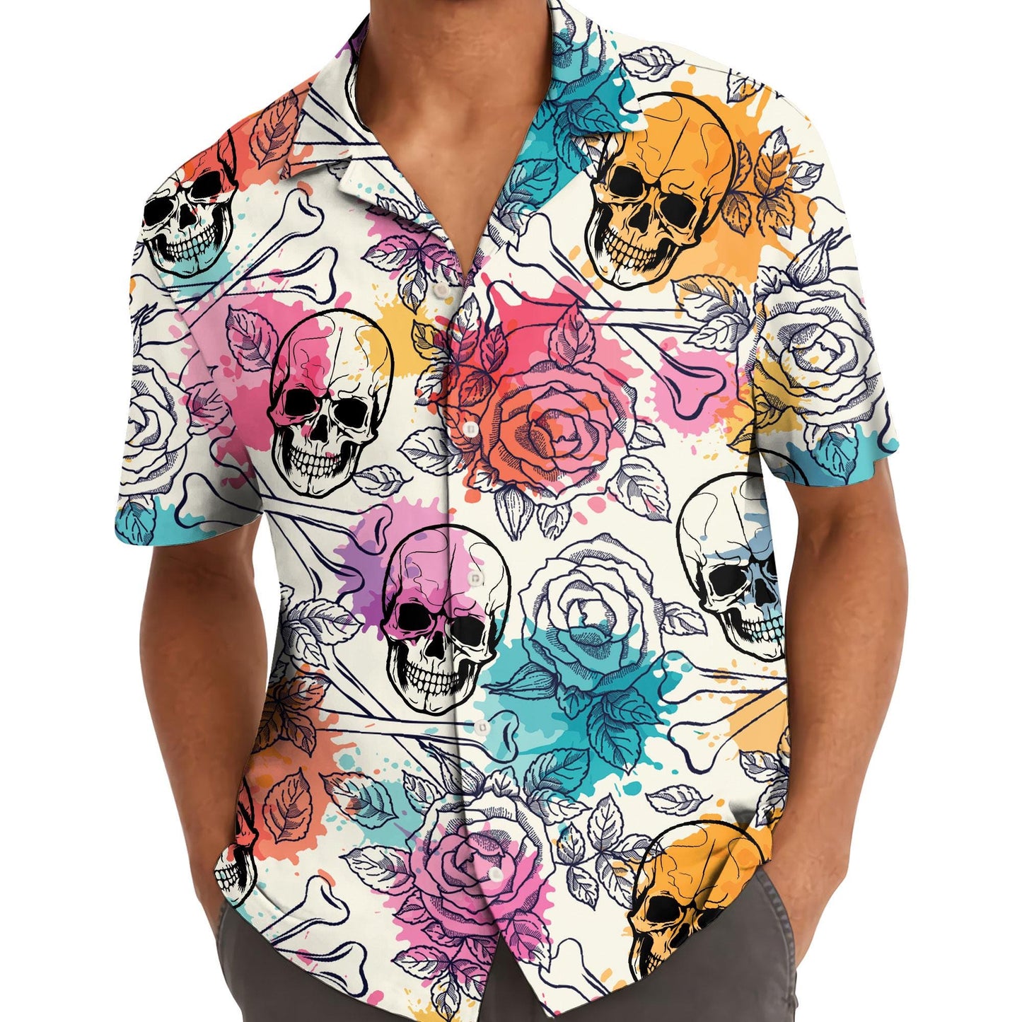 Model wearing colorful skull and rose Hawaiian shirt