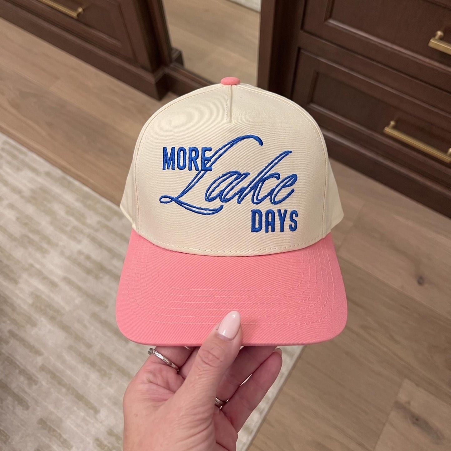 Cream and pink two-tone hat with embroidered More Lake Days lettering