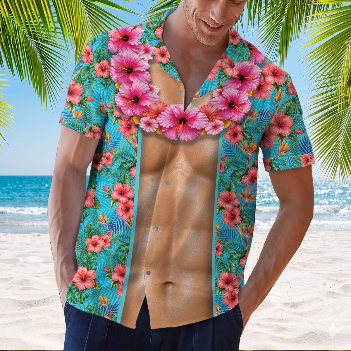 Model wearing a tropical muscle print Hawaiian shirt at the beach