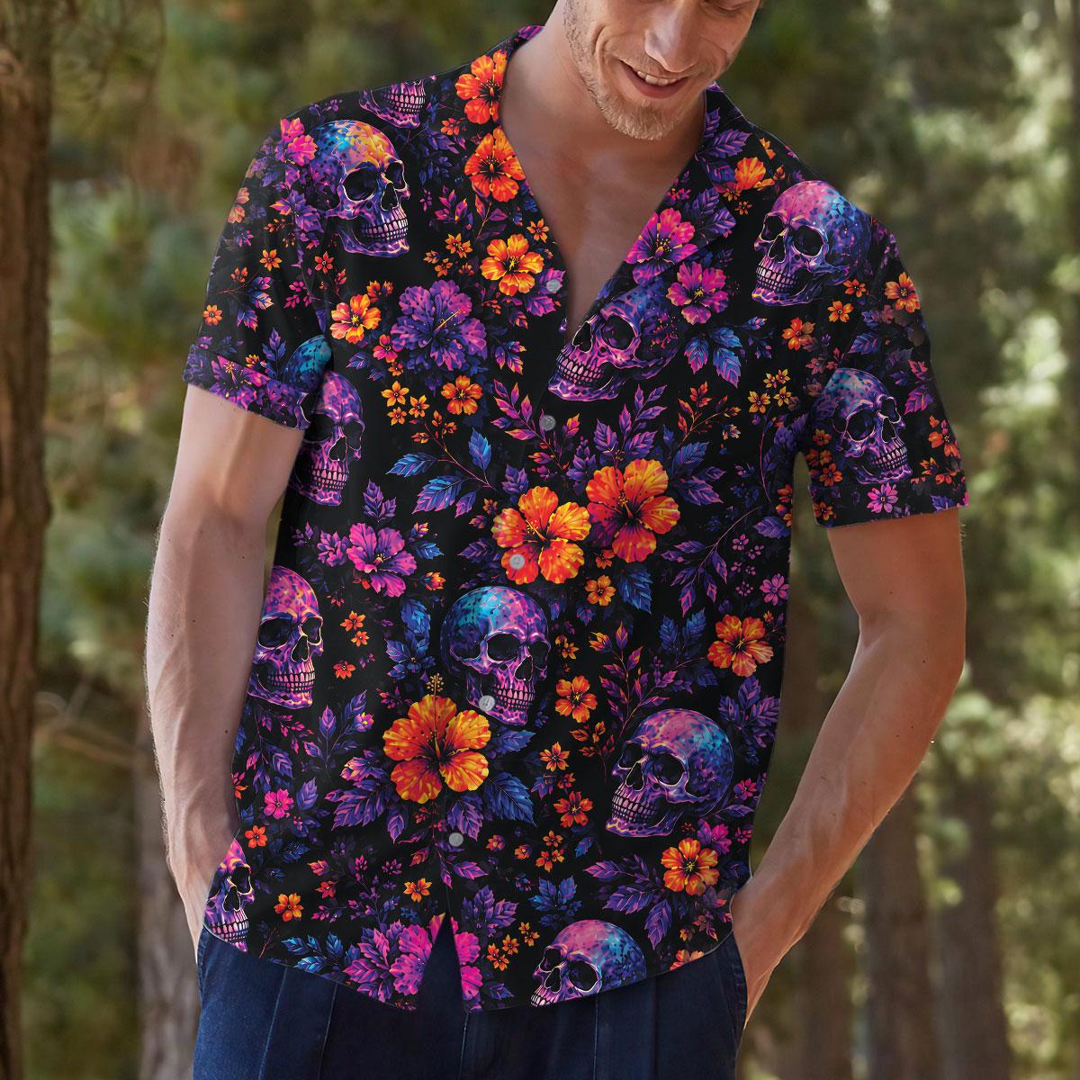 Lifestyle view of a person wearing a colorful skull and flower Hawaiian shirt outdoors