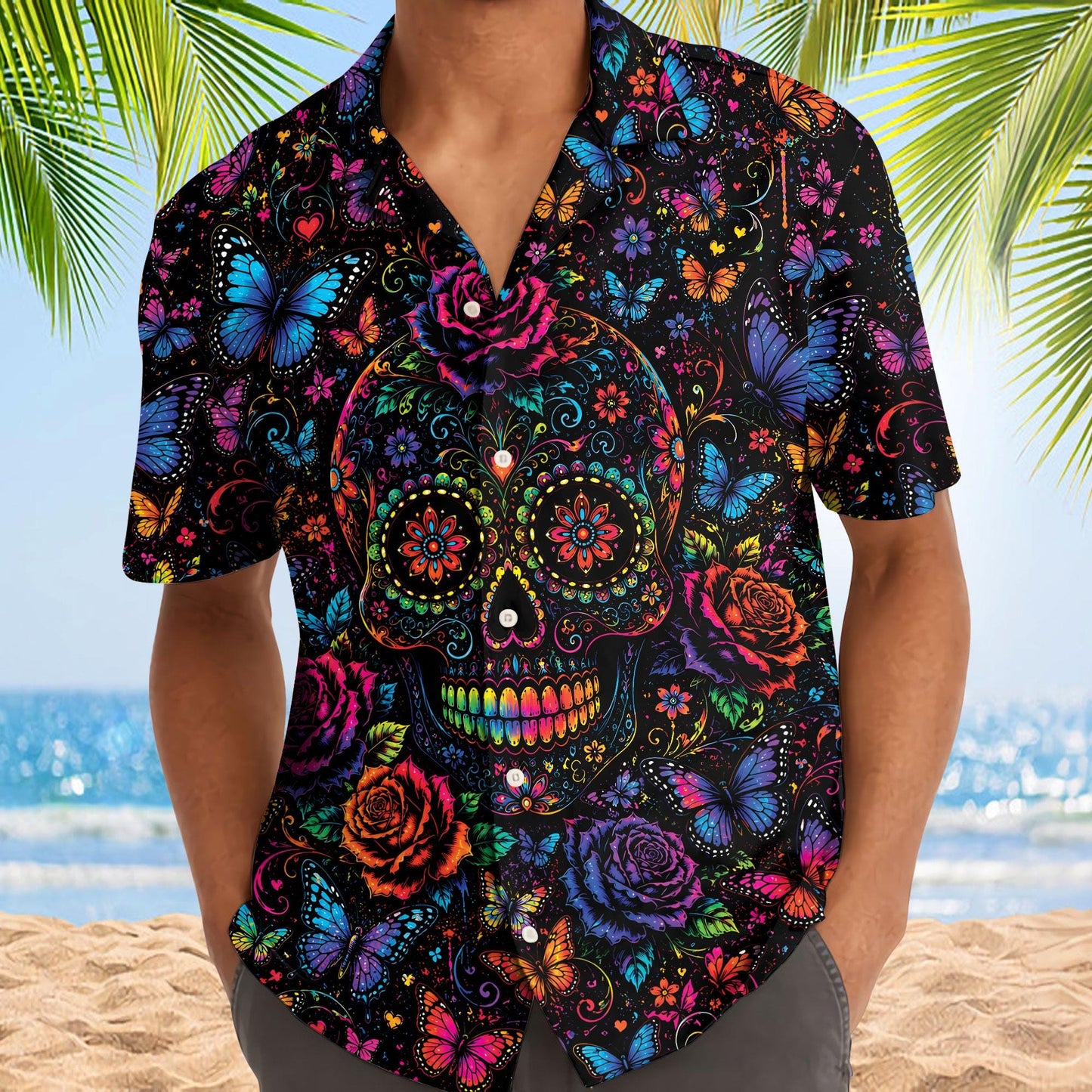 Person wearing a colorful sugar skull Hawaiian shirt with butterflies and roses