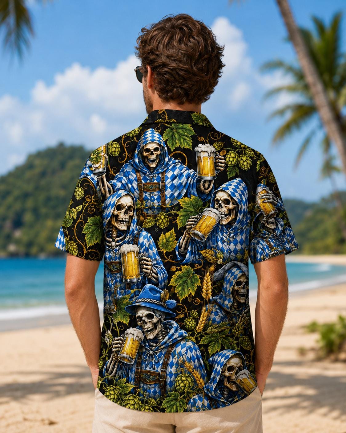 Back view of a man wearing a black Hawaiian shirt covered in blue reapers, skeletons, mugs, and tropical leaves