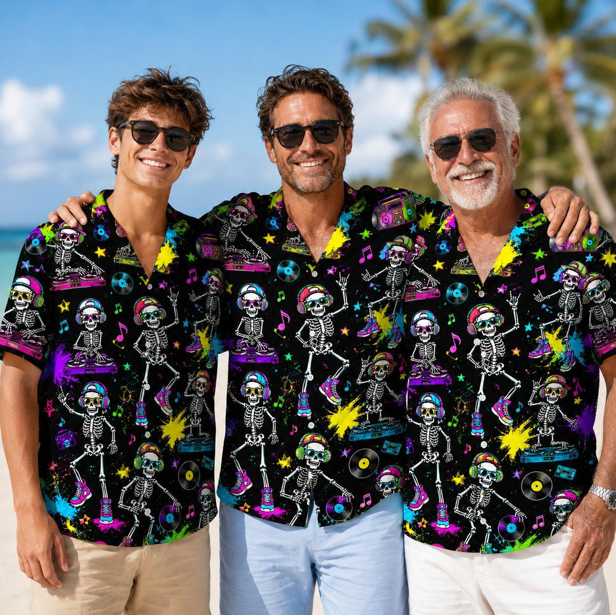 Three people wearing matching neon skeleton DJ Hawaiian shirts at the beach