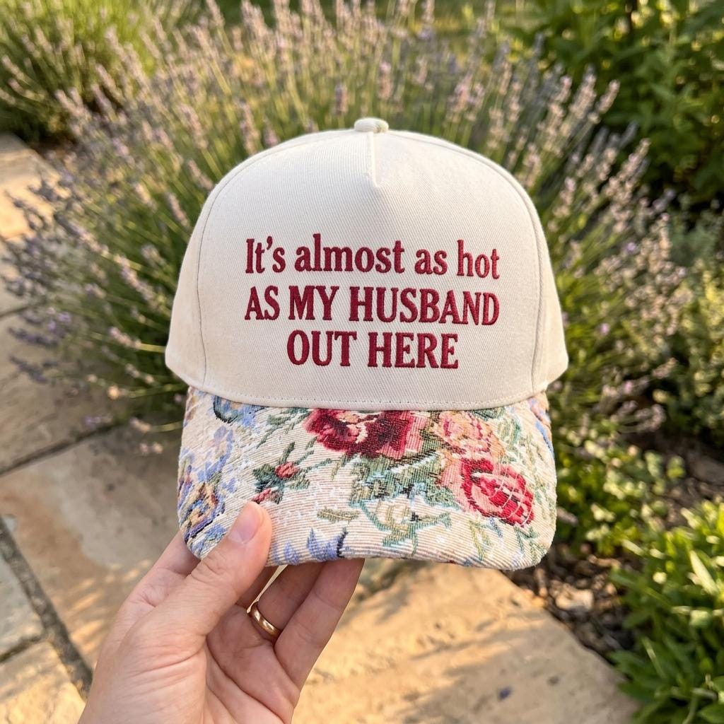 Cream embroidered hat with floral brim and funny husband quote outdoors