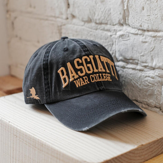 Black washed dad hat with “Basgiath War College” embroidered on front in gold thread