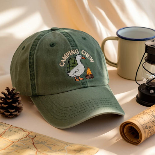 Green dad cap with embroidered duck carrying a backpack near a campfire