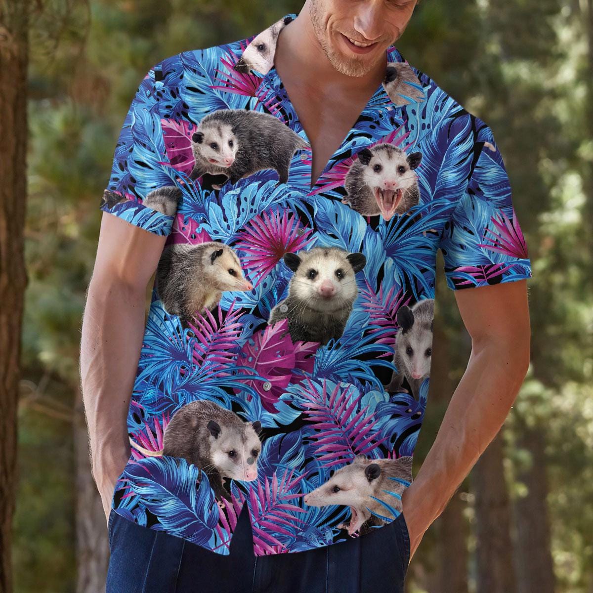 Model wearing the colorful opossum tropical shirt in a natural setting