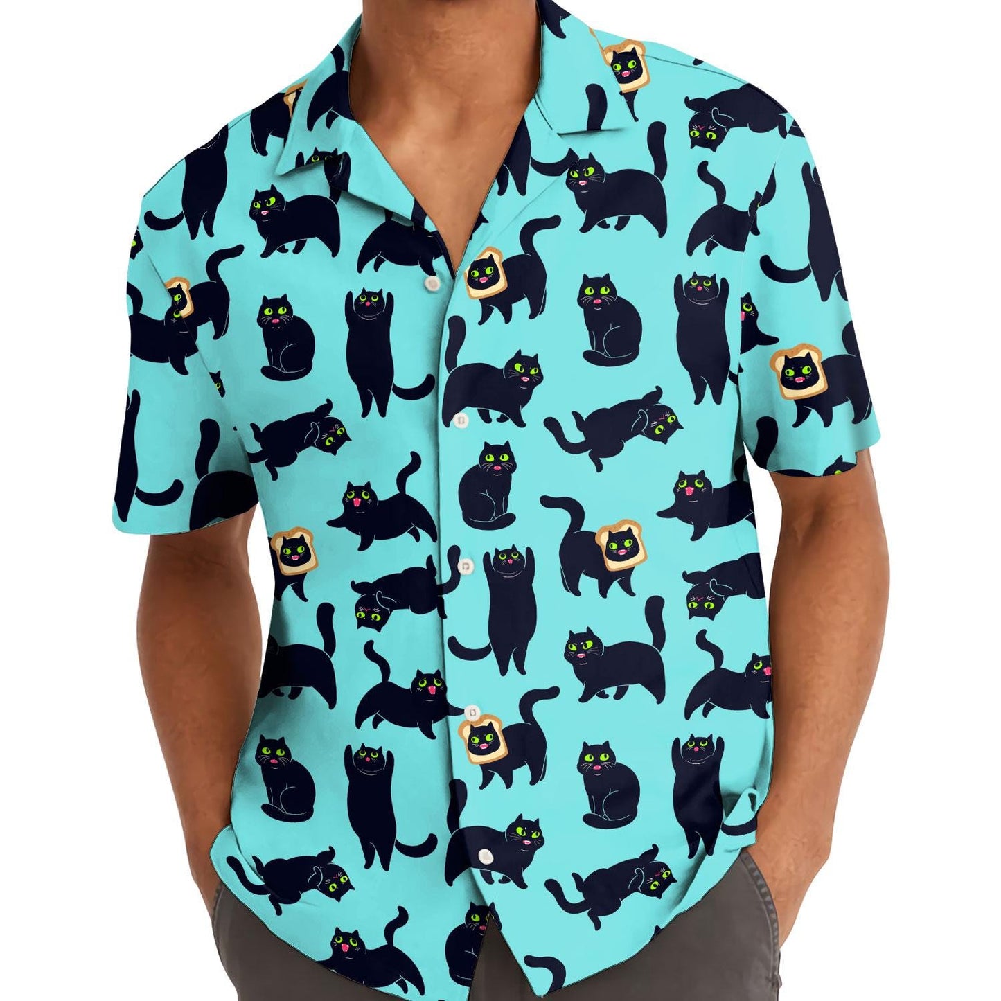 Model wearing an aqua black cat Hawaiian shirt outdoors