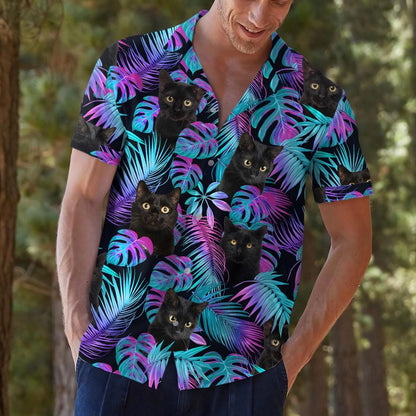 Model styling a black cat palm leaf Hawaiian shirt outdoors