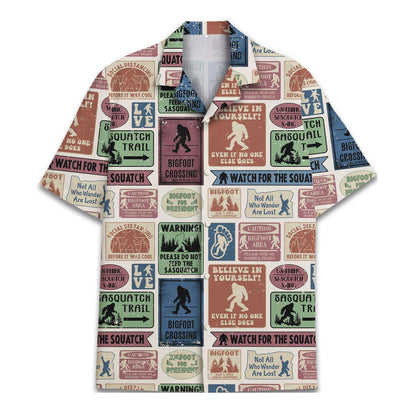 Front view of a Sasquatch-themed Hawaiian shirt with an all-over collage of Bigfoot signs and wilderness graphics