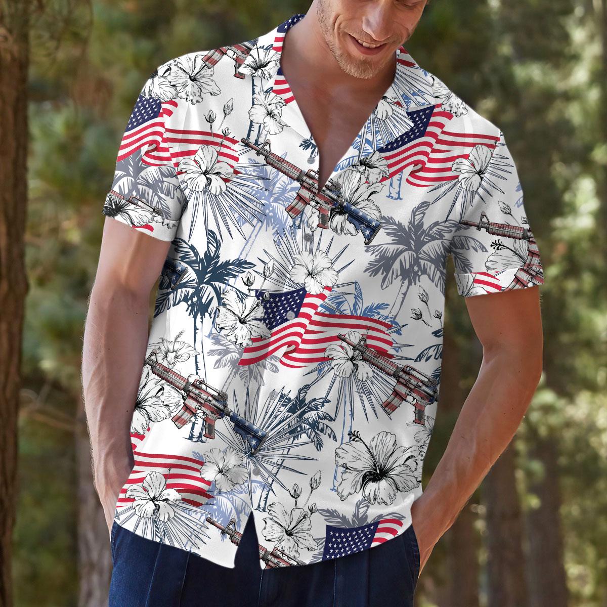 Model wearing patriotic tropical shirt with red white and blue allover print