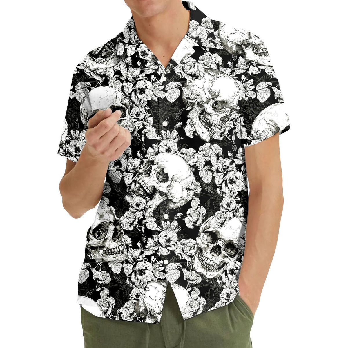 Model wearing a black and white skull floral Hawaiian shirt outdoors