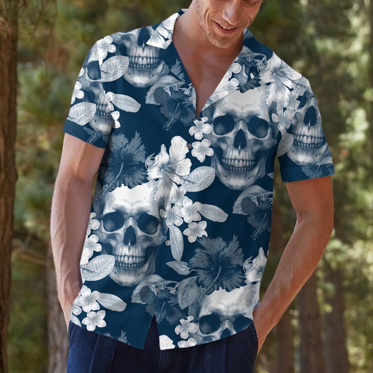 Model wearing a navy skull floral Hawaiian shirt outdoors