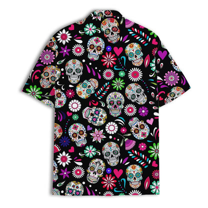 Back view of a black Hawaiian shirt covered in colorful sugar skulls and flowers