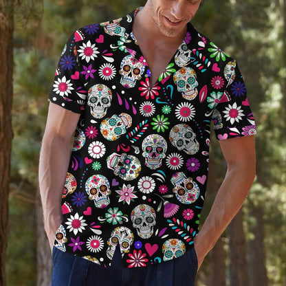 Model wearing a vibrant floral sugar skull Hawaiian shirt with jeans