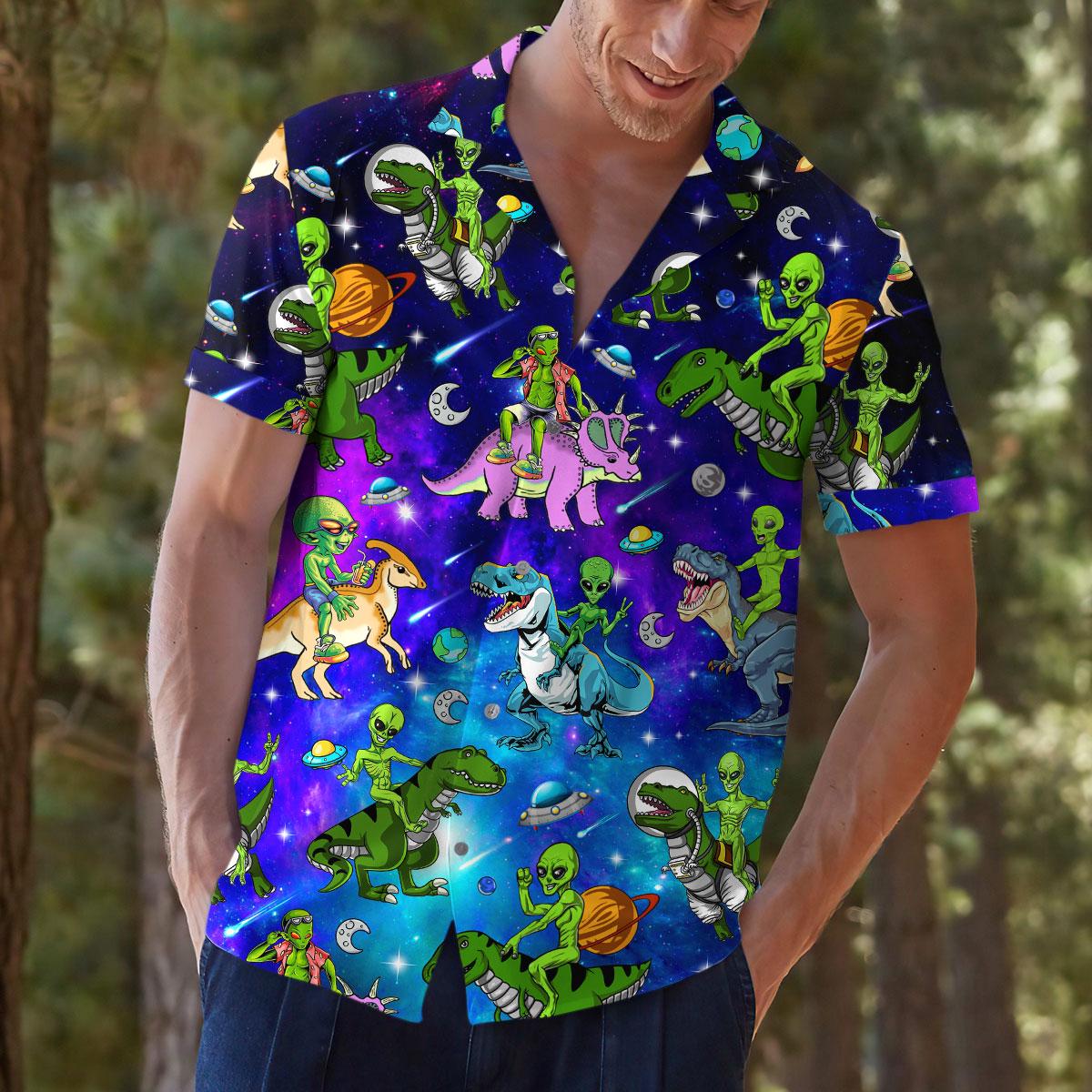 Model wearing a bright galaxy print space shirt