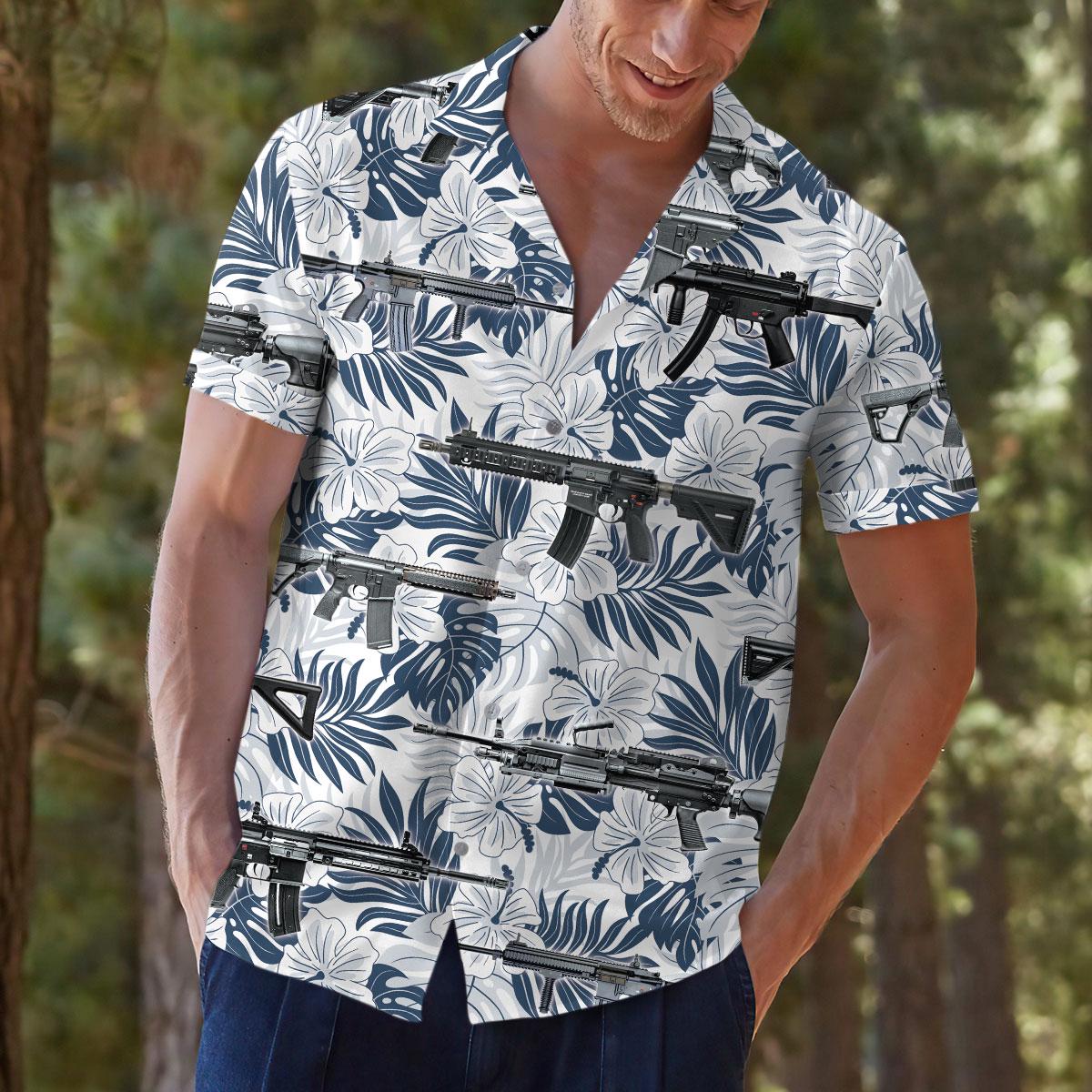 Model wearing the floral firearm Hawaiian shirt outdoors with casual trousers