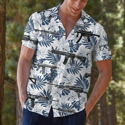 Model wearing the floral firearm Hawaiian shirt outdoors with casual trousers