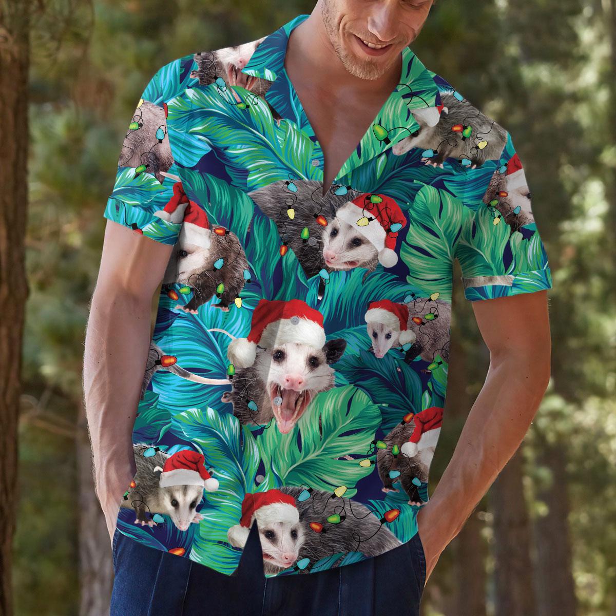 Model wearing a tropical opossum holiday shirt in a natural setting