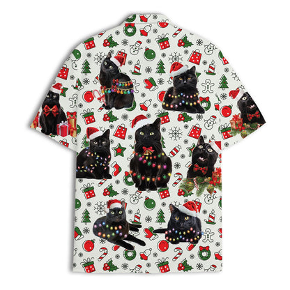 Flat front view of a white Christmas Hawaiian shirt featuring black cats, presents, ornaments, and candy canes.