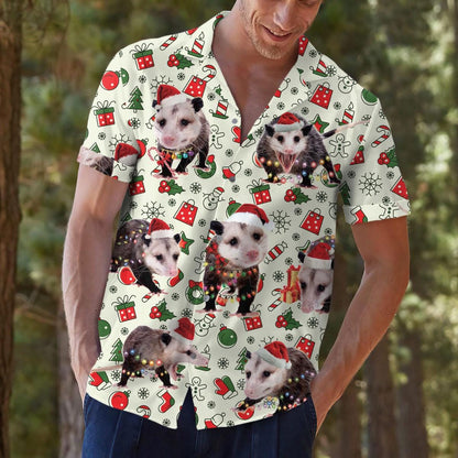 Model outdoors wearing a festive opossum print button-up shirt with jeans