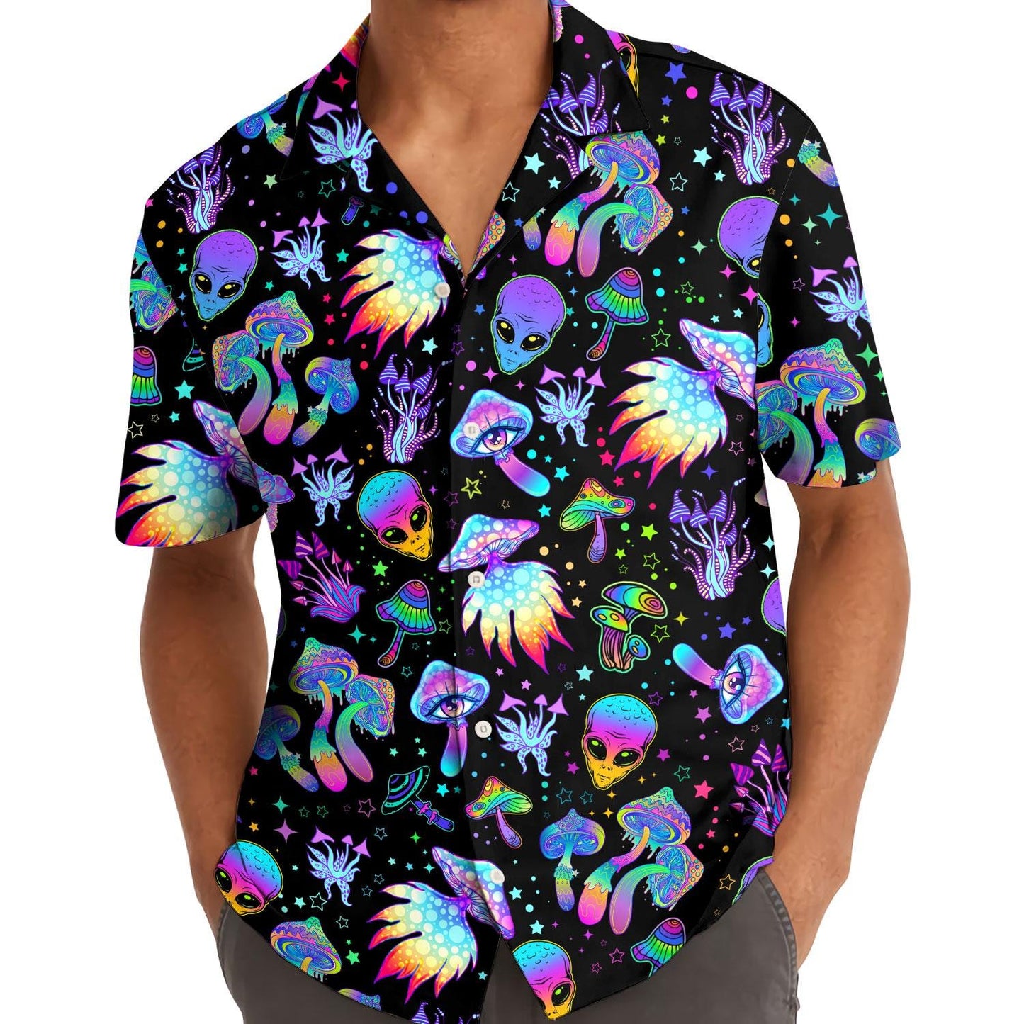 Model wearing black neon alien and mushroom Hawaiian shirt outdoors