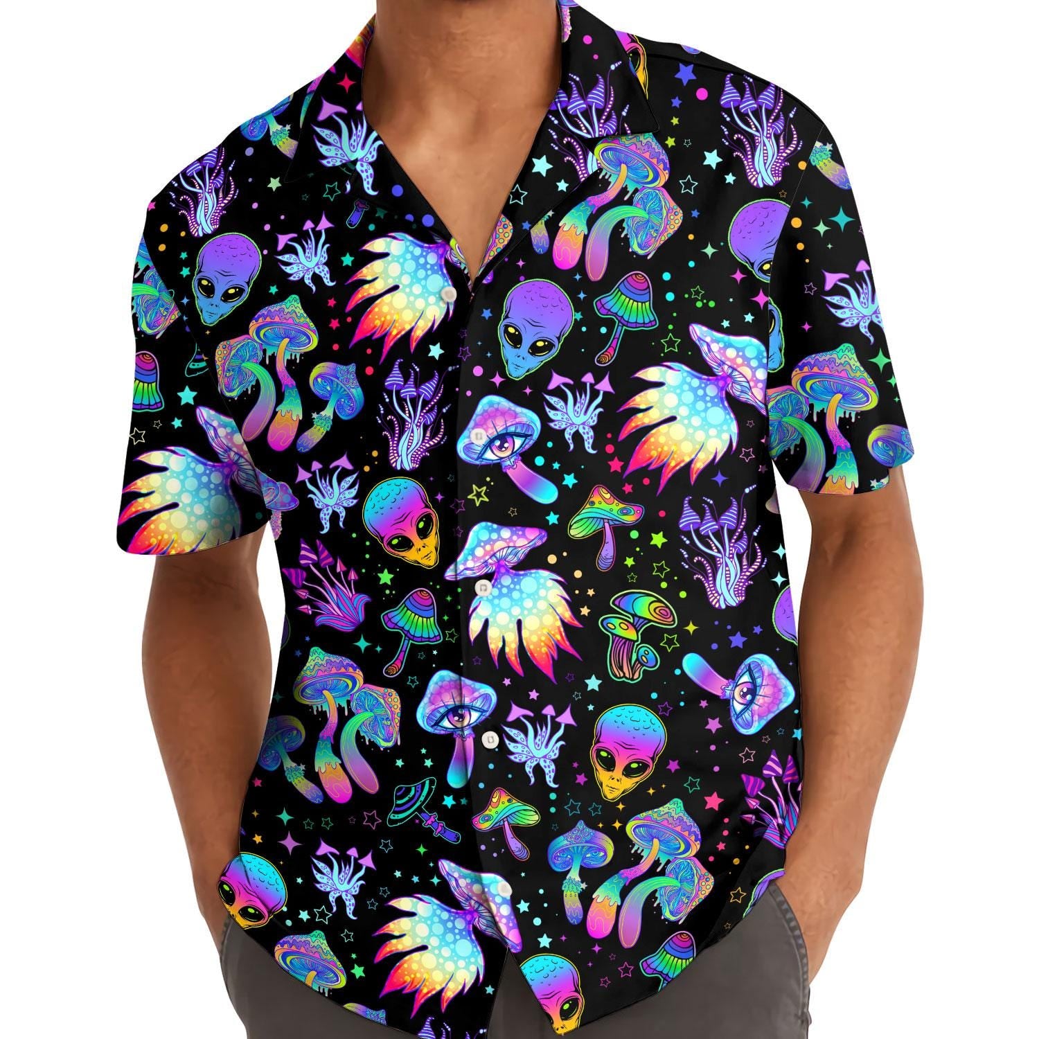 Model wearing black neon alien and mushroom Hawaiian shirt outdoors