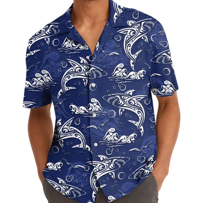 Model wearing blue dolphin and wave Hawaiian shirt outdoors