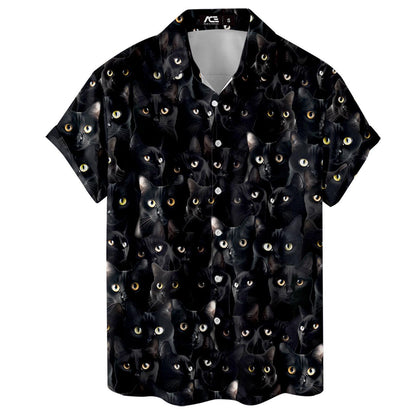 Front flat view of a button-front black cat Hawaiian shirt with varied eye colors