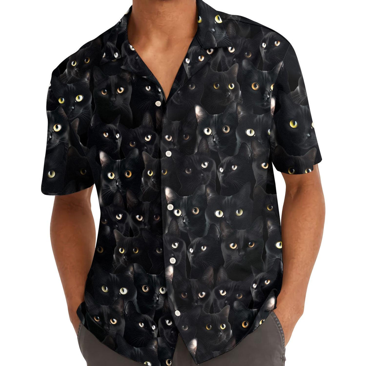 Model wearing the black cat Hawaiian shirt with hands in pockets