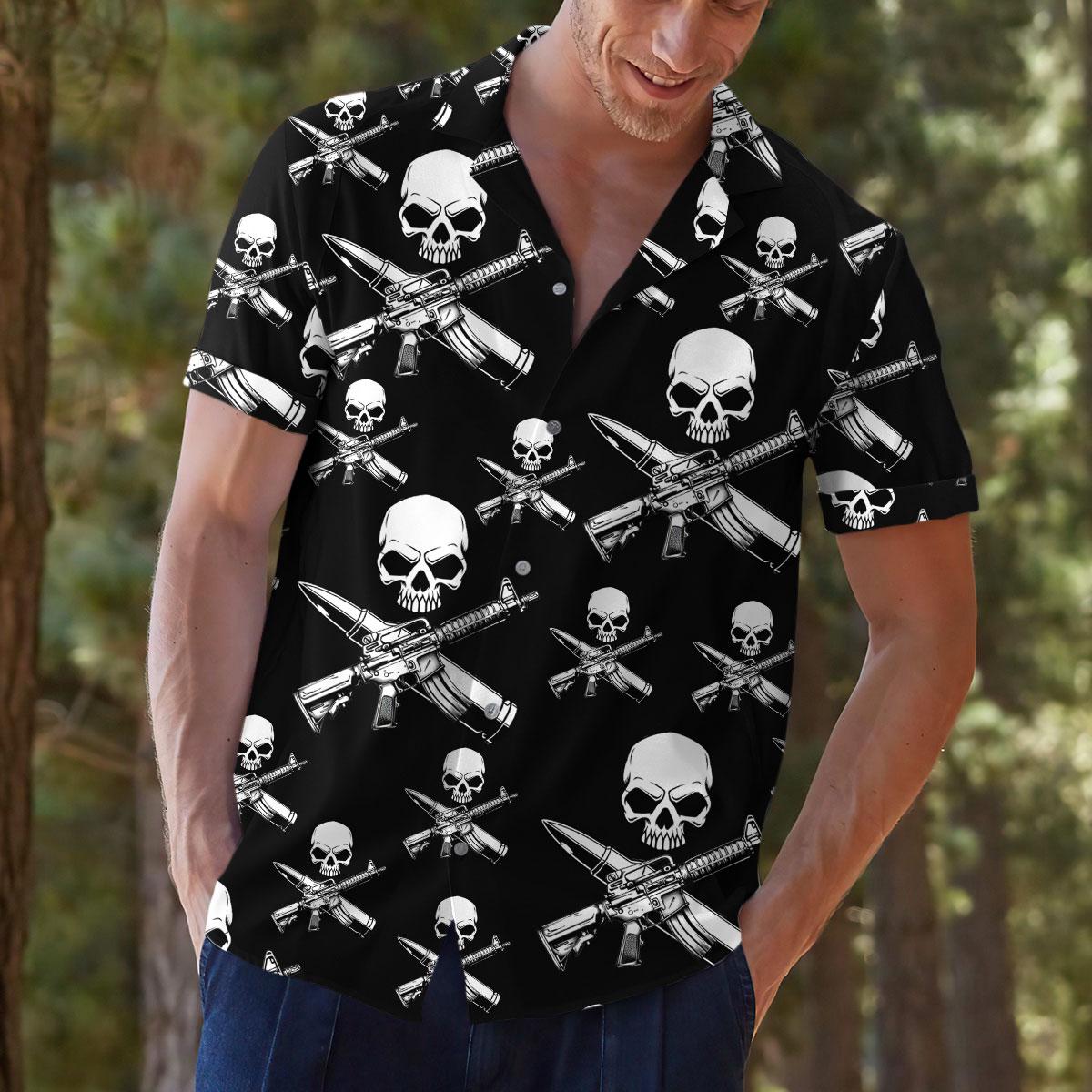 Model outdoors wearing the black graphic Hawaiian shirt