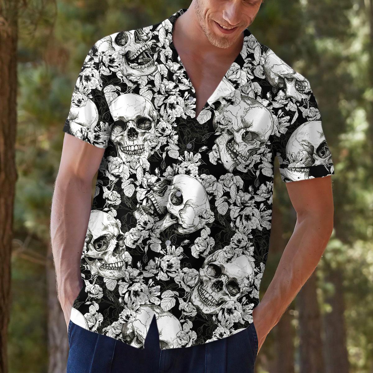Close view of a person wearing a black and white skull Hawaiian shirt
