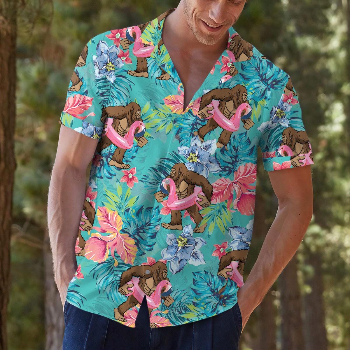 Lifestyle view of a model wearing the colorful tropical ape and flamingo shirt