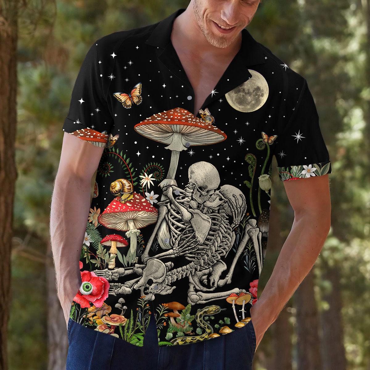 Model outdoors wearing fantasy mushroom and skeleton Hawaiian shirt