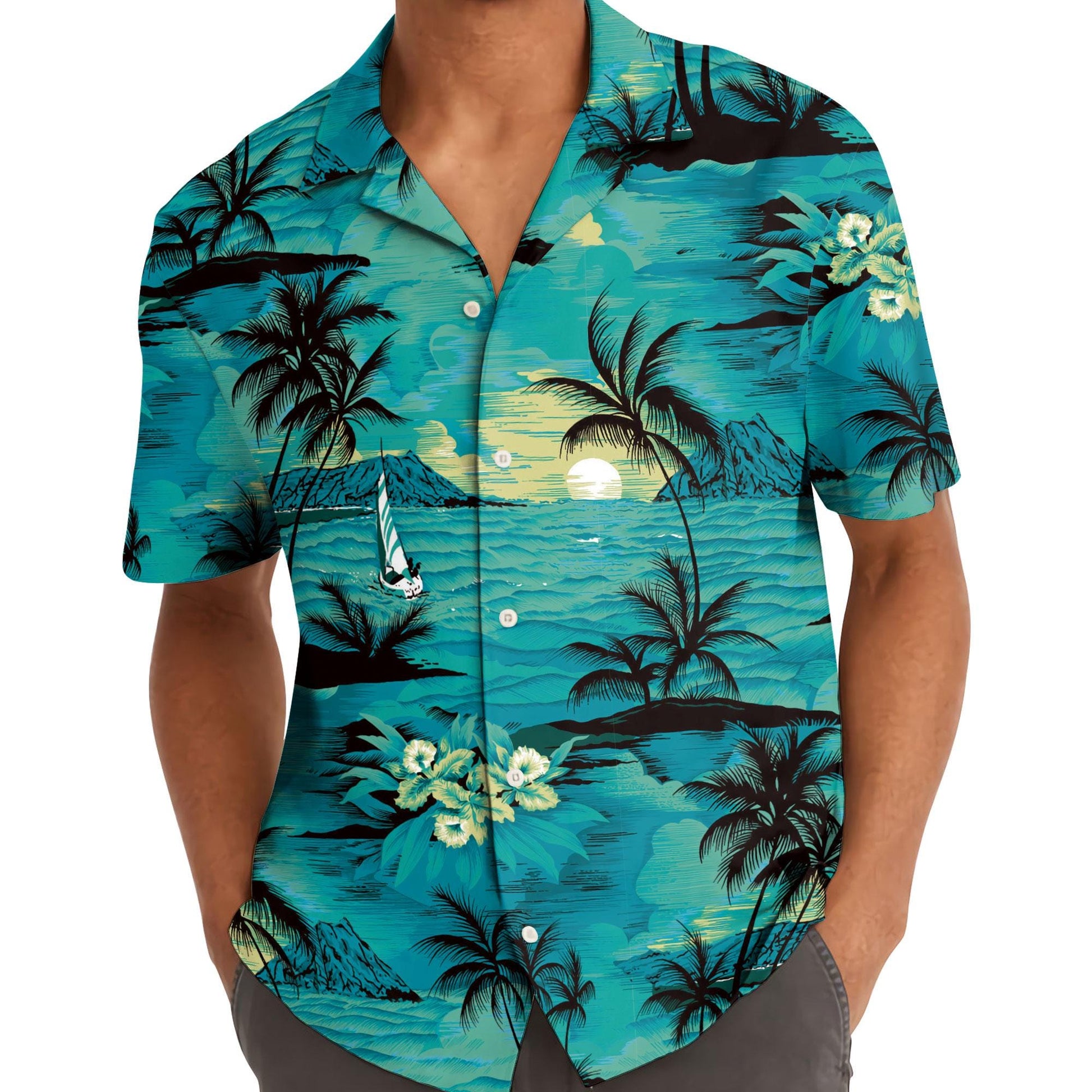 Model wearing a turquoise Hawaiian shirt with palm trees, sunset, sailboat, and ocean design
