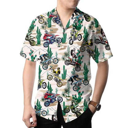 Model wearing a colorful dirt bike and cactus Hawaiian shirt with dark pants