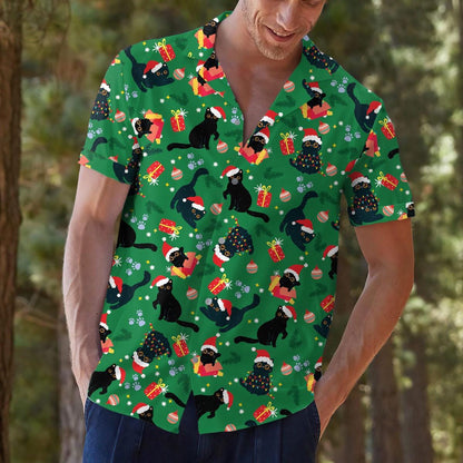 Close view of model wearing festive green cat holiday shirt