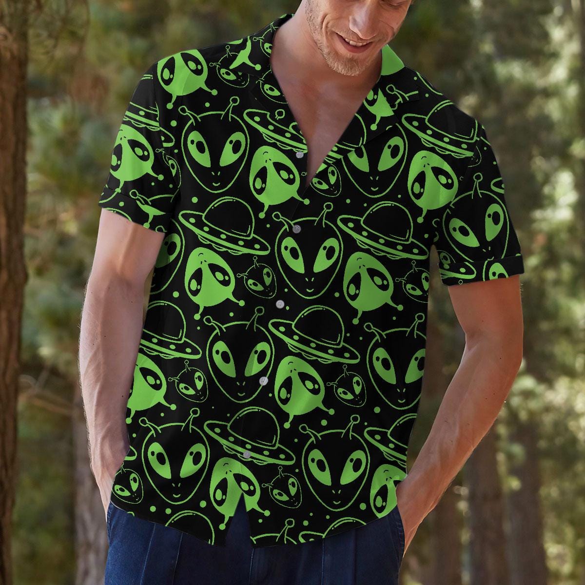 Model wearing alien Hawaiian shirt with flying saucer pattern