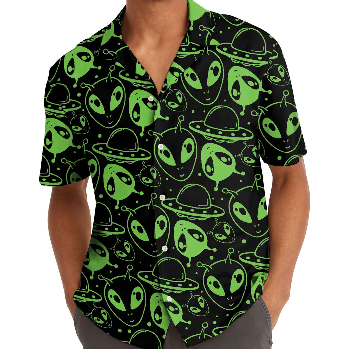 Model wearing neon green alien print Hawaiian shirt outdoors