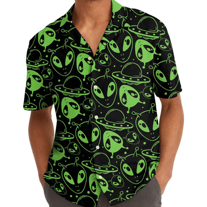Model wearing neon green alien print Hawaiian shirt outdoors