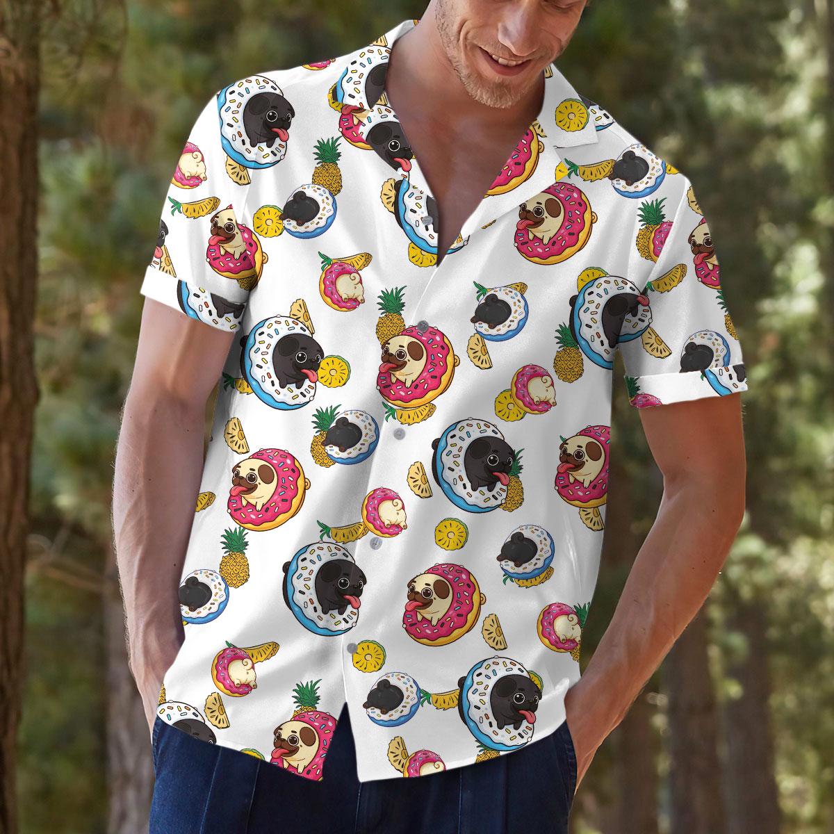 Lifestyle view of model wearing bright tropical sloth print shirt outdoors