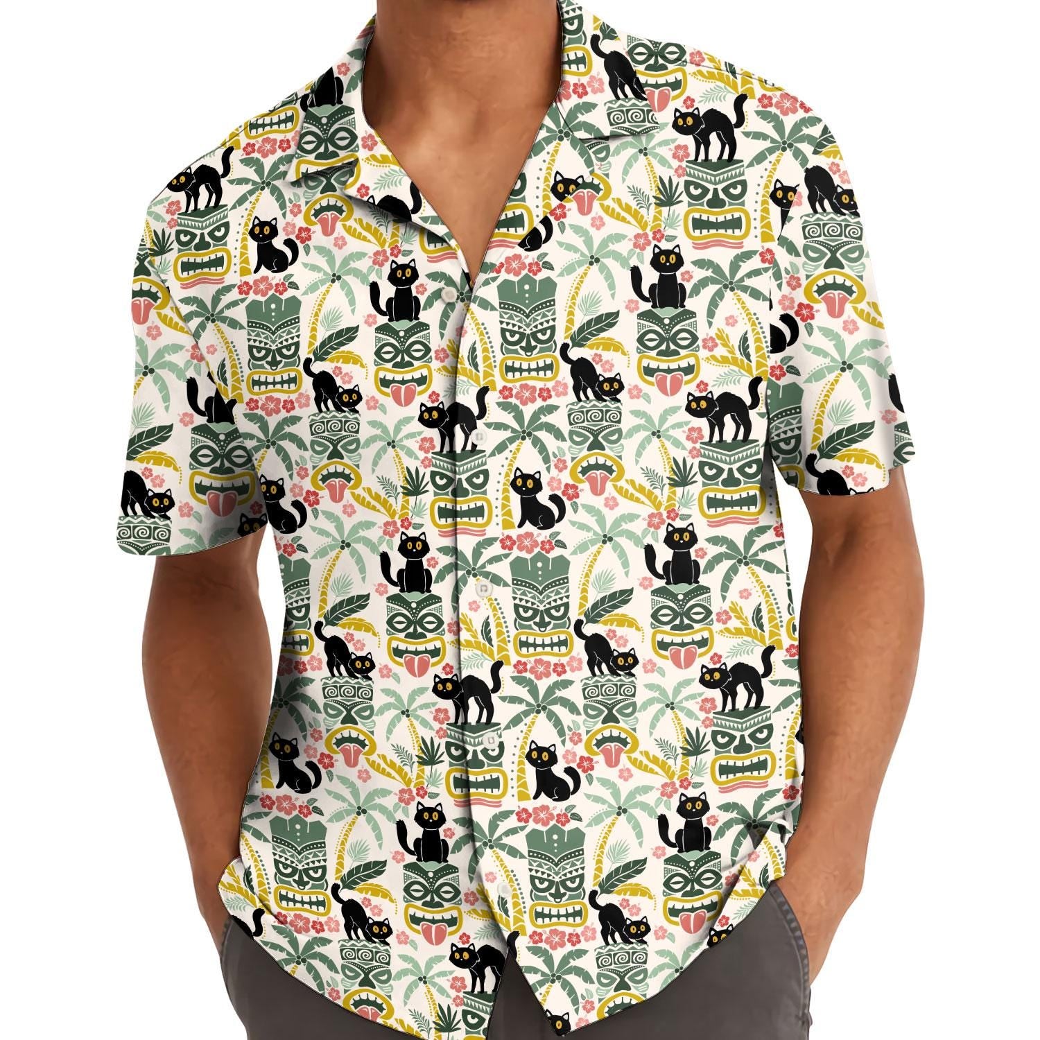 Model wearing the black cat tiki Hawaiian shirt with hands in pockets