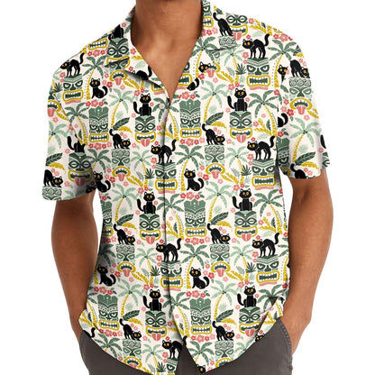Model wearing the black cat tiki Hawaiian shirt with hands in pockets