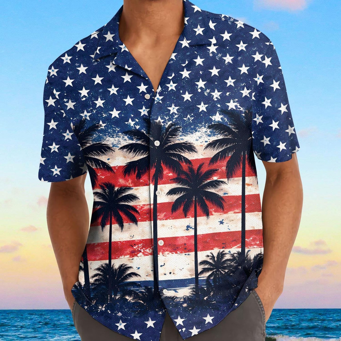 Model wearing patriotic palm tree Hawaiian shirt by the ocean