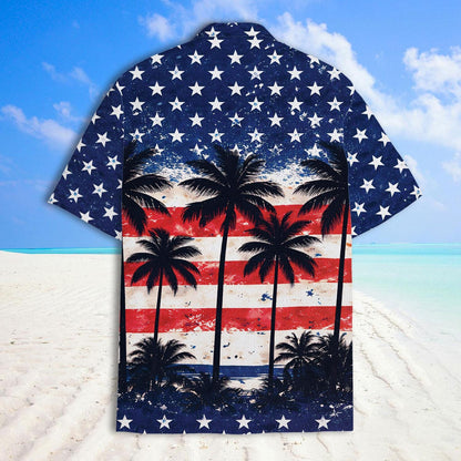 American flag palm tree button-up shirt shown on a sunny beach