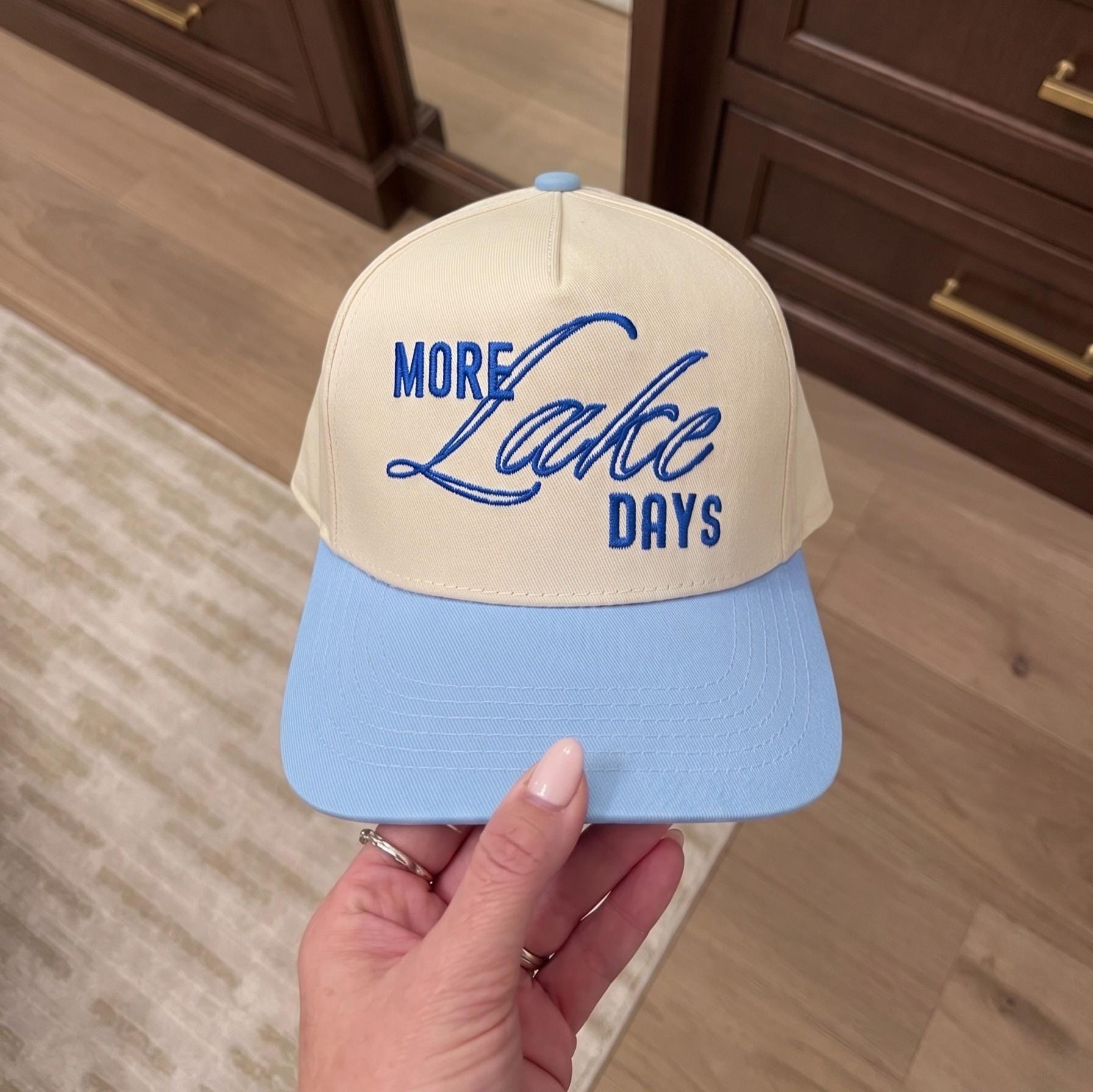 Cream and light blue two-tone hat with embroidered More Lake Days lettering