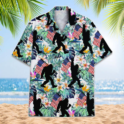 Front view of a tropical Hawaiian shirt with American flags, flowers, foliage, and black action silhouettes